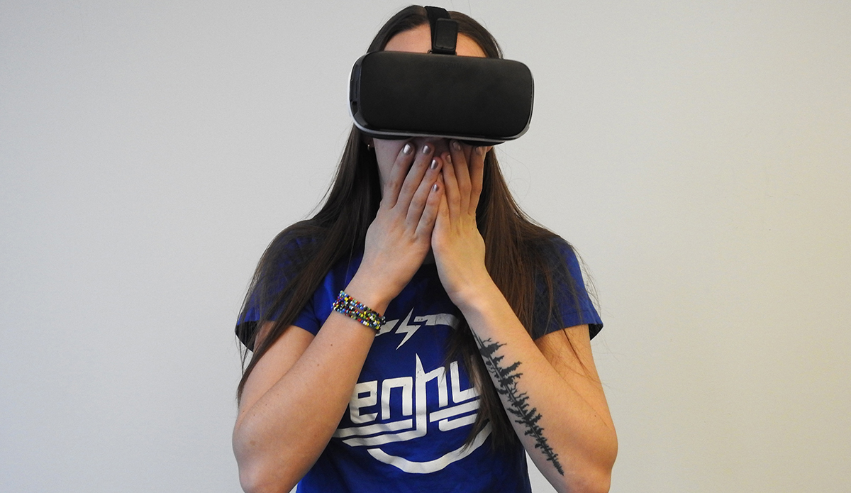 A person wearing a VR headset, exploring a horror movie in virtual reality