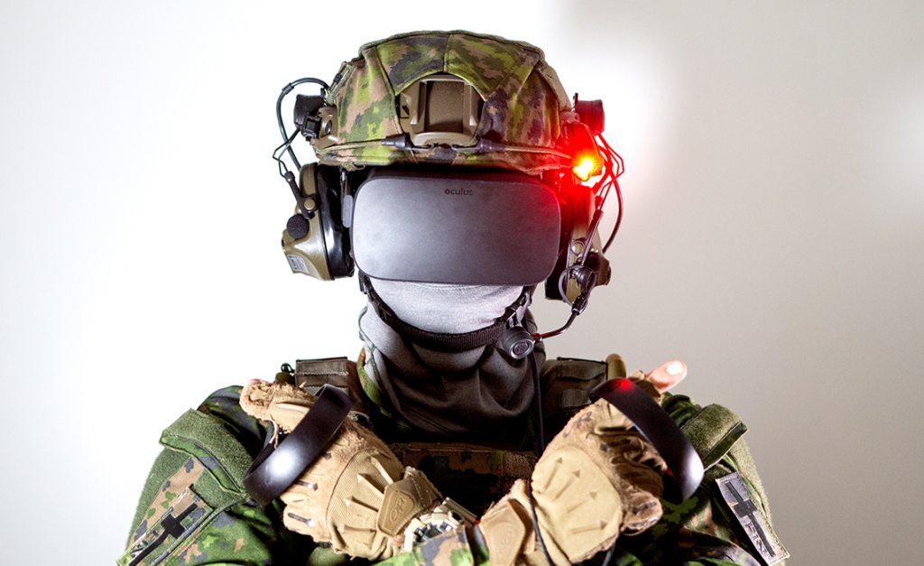 A soldier wearing a virtual reality headset and interacting with a simulated environment