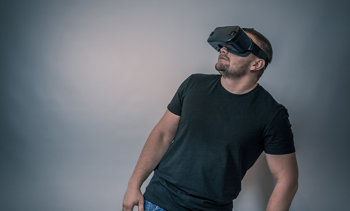 A father using a virtual reality headset