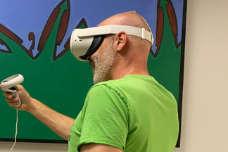 A person wearing a VR headset, learning in a virtual environment