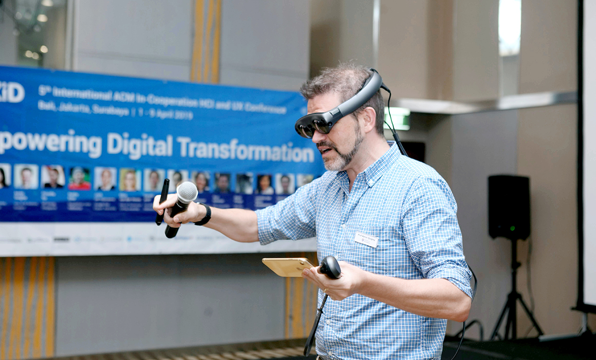 A person using a VR headset, exploring a physical and virtual world