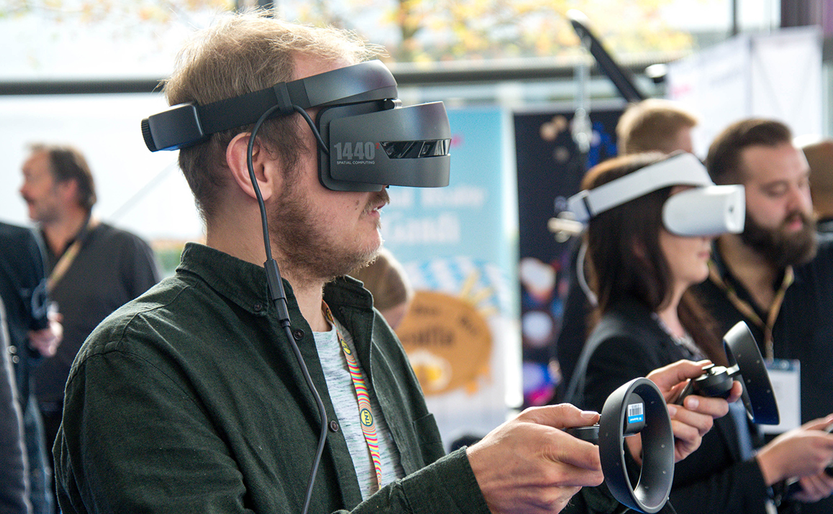 A person wearing a virtual reality headset and exploring a virtual world