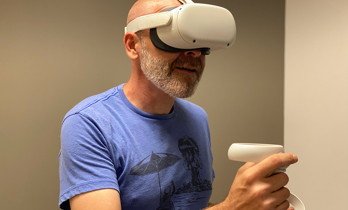 A person wearing a VR headset, immersed in a virtual world