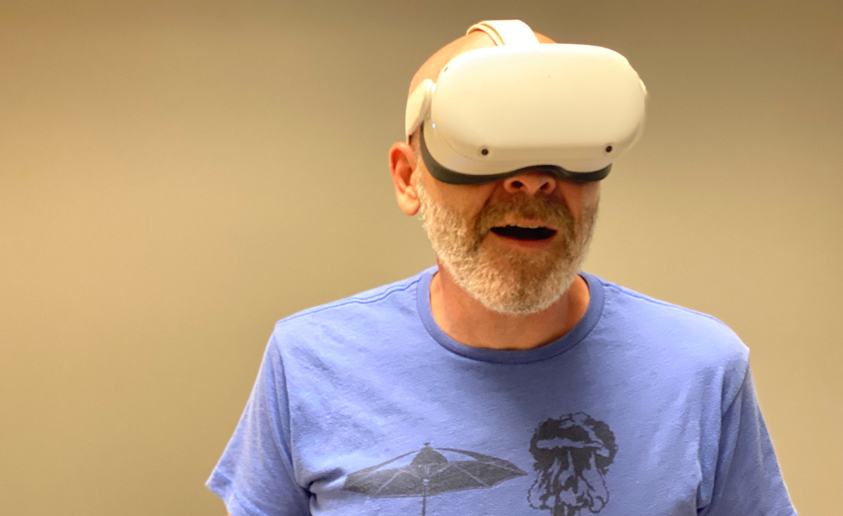 A person wearing a virtual reality headset, immersed in a virtual world