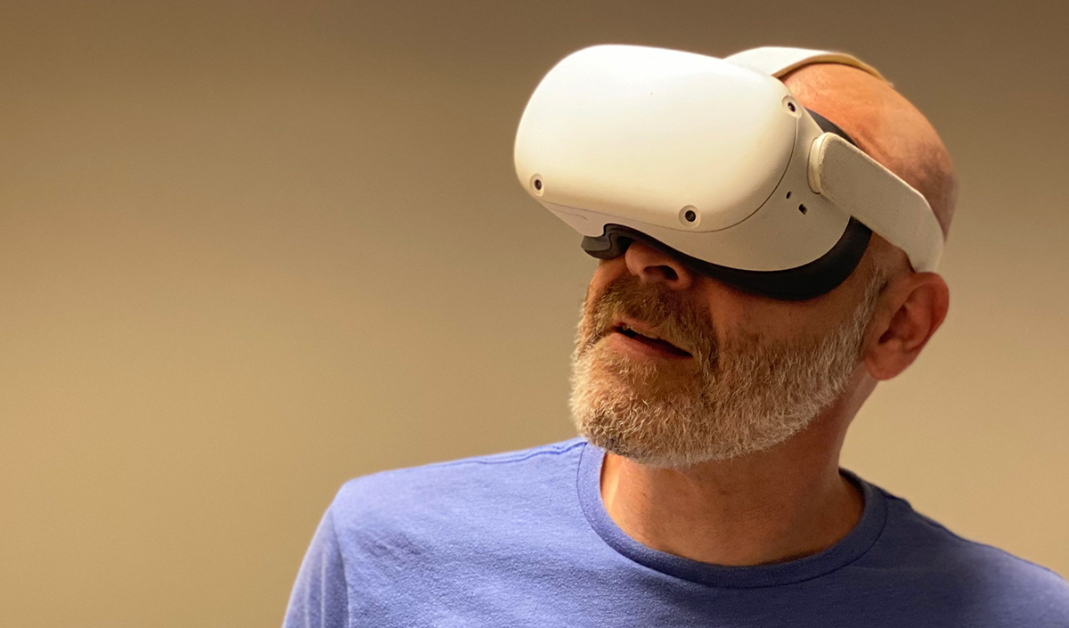 A Person using virtual reality headsets to explore virtual reality tourism destinations